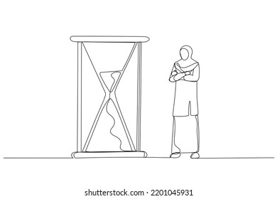 Cartoon Of Muslim Businesswoman Standing And Looking At Hourglass While Time Goes By. Patience Concept. Continuous Line Art
