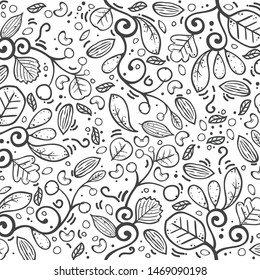 Cartoon natural food pattern with different sorts of nuts and green leaves vector illustration - Vector 