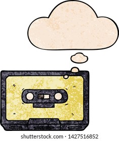 cartoon old cassette tape with thought bubble in grunge texture style