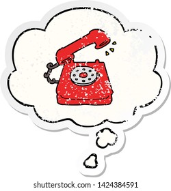 cartoon old telephone with thought bubble as a distressed worn sticker