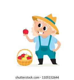 Cartoon old woman farmer holding apple with basket isolated on white. Standing and smyling female character in blue coverall