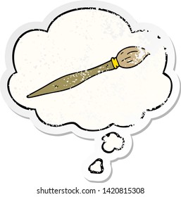 cartoon paint brush with thought bubble as a distressed worn sticker