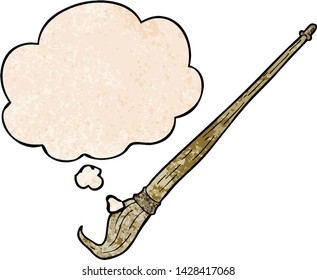 cartoon paint brush with thought bubble in grunge texture style