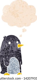 cartoon penguin with thought bubble in grunge distressed retro textured style
