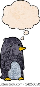 cartoon penguin with thought bubble in grunge texture style