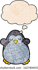 cartoon penguin with thought bubble in grunge texture style