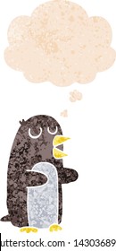 cartoon penguin with thought bubble in grunge distressed retro textured style