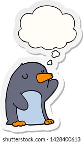 cartoon penguin with thought bubble as a printed sticker