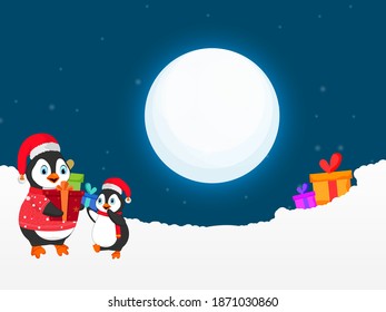Cartoon Penguins Character With Gift Boxes And Snowy On Full Moon Blue Background.