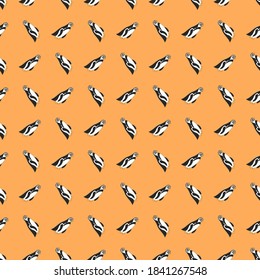 
Cartoon penguins vector seamless pattern. Penguin on a yellow background. A ready-made template for wrapping paper, children's wallpaper.