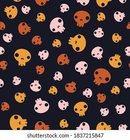 Cartoon pink, yellow and brown sculls isolated on black background. Vector seamless pattern. Halloween backdrop. Simple flat design for textile, wrapping paper, wallpaper, web design.