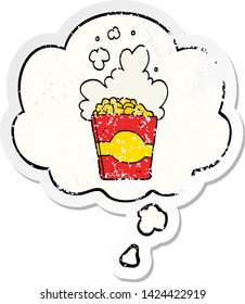 cartoon popcorn with thought bubble as a distressed worn sticker