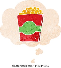 cartoon popcorn with thought bubble in grunge distressed retro textured style