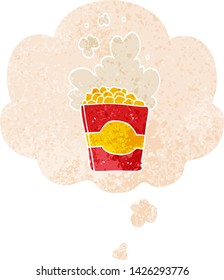 cartoon popcorn with thought bubble in grunge distressed retro textured style