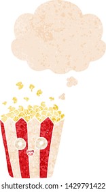 cartoon popcorn with thought bubble in grunge distressed retro textured style