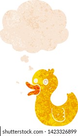 cartoon quacking duck with thought bubble in grunge distressed retro textured style