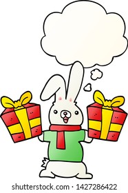 cartoon rabbit with christmas presents with thought bubble in smooth gradient style