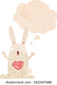 cartoon rabbit in love with thought bubble in grunge distressed retro textured style