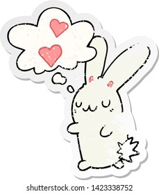 cartoon rabbit in love with thought bubble as a distressed worn sticker