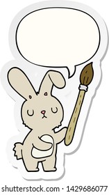 conejo de dibujos animados con pincel de pintura con pegatina de burbujas de voz