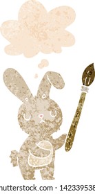 cartoon rabbit with paint brush with thought bubble in grunge distressed retro textured style