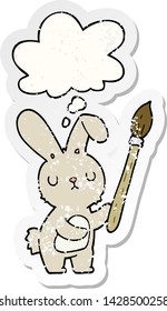 conejo de dibujos animados con pincel de pintura con burbuja de pensamiento como pegatina gastada angustiada
