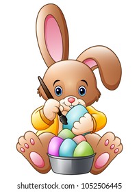 Cartoon rabbit painting an eggs
