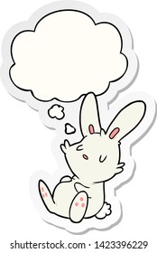 cartoon rabbit sleeping with thought bubble as a printed sticker