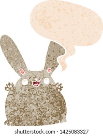 cartoon rabbit with speech bubble in grunge distressed retro textured style