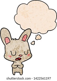 cartoon rabbit talking with thought bubble in grunge texture style