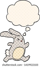 cartoon rabbit with thought bubble in comic book style