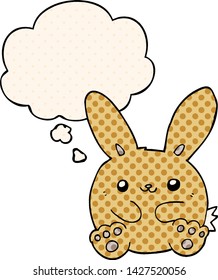 cartoon rabbit with thought bubble in comic book style