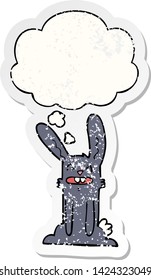 cartoon rabbit with thought bubble as a distressed worn sticker