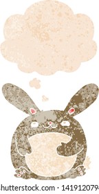 cartoon rabbit with thought bubble in grunge distressed retro textured style