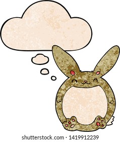 cartoon rabbit with thought bubble in grunge texture style