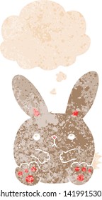 cartoon rabbit with thought bubble in grunge distressed retro textured style