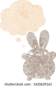 cartoon rabbit with thought bubble in grunge distressed retro textured style