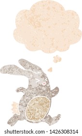 conejo de dibujos animados con burbuja de pensamiento en un estilo retro angustiado con texturas estrafalarias