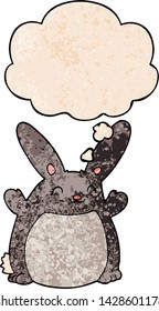 cartoon rabbit with thought bubble in grunge texture style