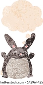 conejo de dibujos animados con burbuja de pensamiento en un estilo retro angustiado con texturas estrafalarias