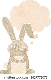 cartoon rabbit with thought bubble in grunge distressed retro textured style