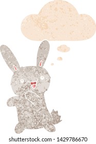 conejo de dibujos animados con burbuja de pensamiento en un estilo retro angustiado con texturas estrafalarias