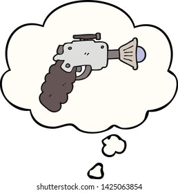 pistola de rayos de dibujos animados con burbuja de pensamiento