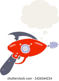 pistola de rayos de dibujos animados con burbuja de pensamiento en estilo retro