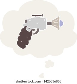 pistola de rayos de dibujos animados con burbuja de pensamiento en estilo retro
