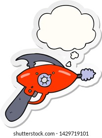cartoon ray gun with thought bubble as a printed sticker