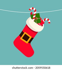 Cartoon red and white sock with gifts. Stocking hanging on a rope. Christmas and New year holiday.
