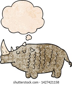 cartoon rhinoceros with thought bubble in grunge texture style