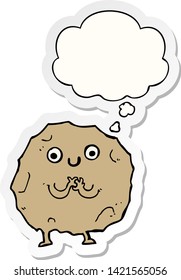 cartoon rock character with thought bubble as a printed sticker