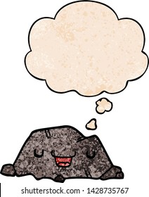 cartoon rock with thought bubble in grunge texture style